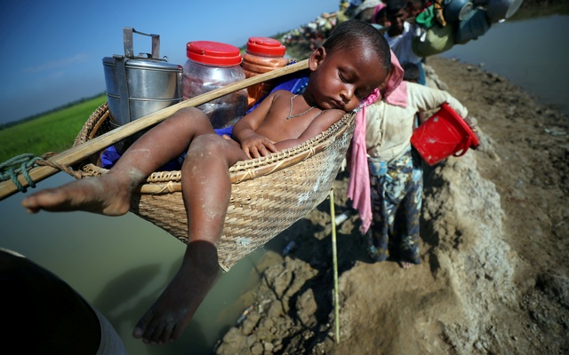 Rohingya-refugee-child-is-carried.JPG