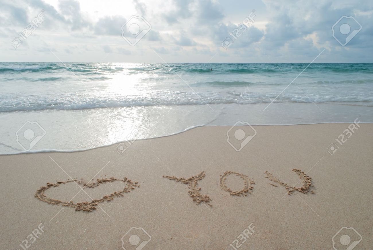 18936635-The-Word-love-you-Written-in-the-Sand-on-a-Beach-at-Phuket-island-Thailand-Stock-Photo.jpg