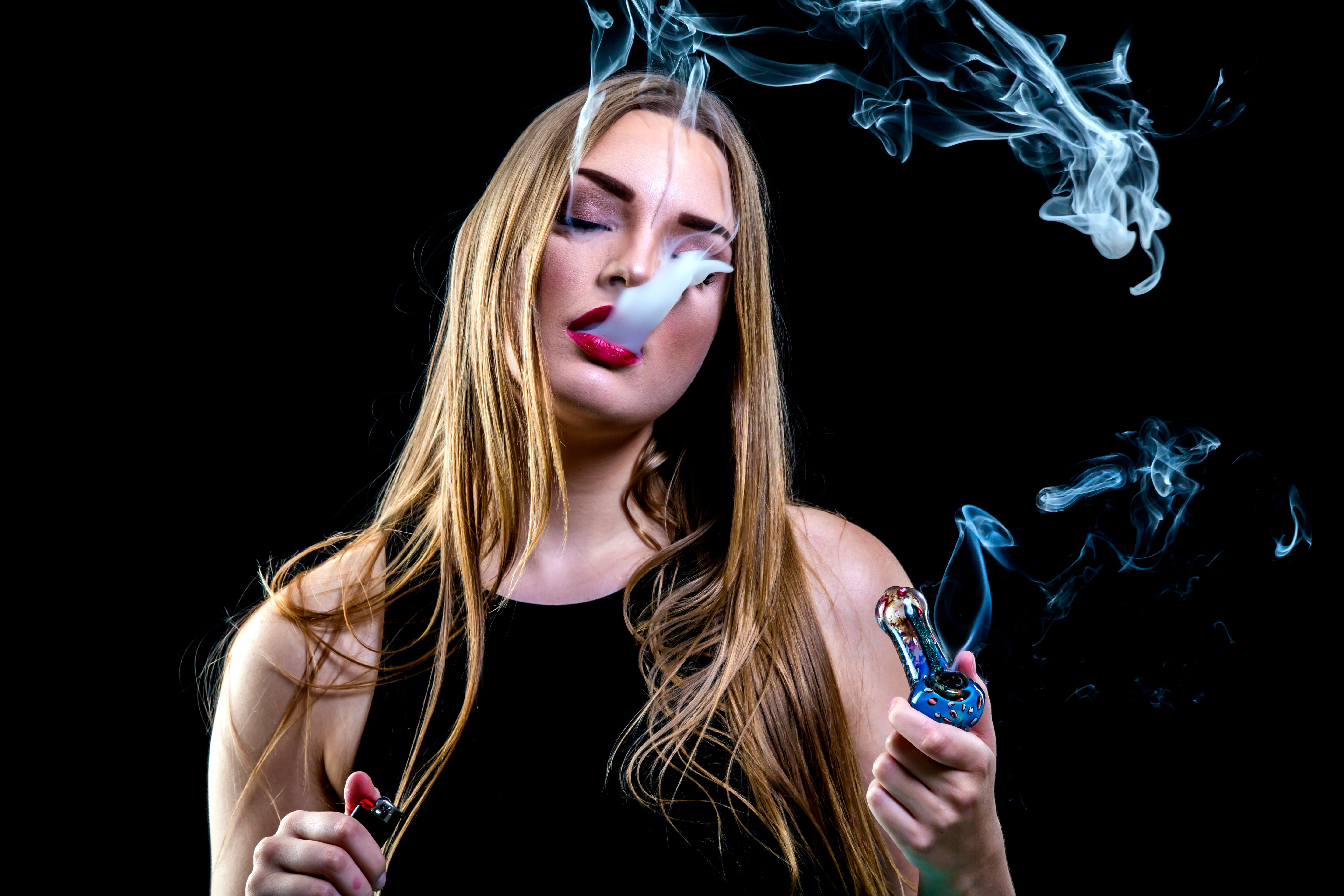 blonde female in black shirt smoking glass pipe 64 alexander mazzei copy.jpg