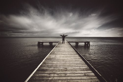 drugabuse_shutterstock-38521750-man-at-end-of-dock-celebrating-FI.jpg