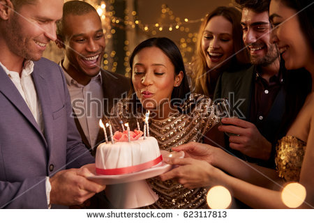 stock-photo-woman-blowing-out-candles-on-birthday-cake-623117813.jpg