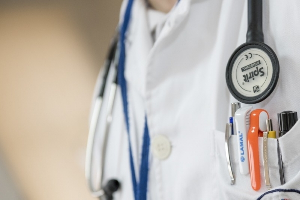 close-up-of-doctor-with-stethoscope-and-ballpens.jpg