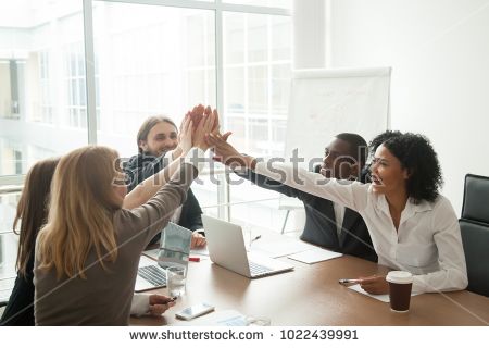 stock-photo-excited-african-and-caucasian-business-team-giving-high-five-at-office-meeting-motivated-by-victory-1022439991.jpg