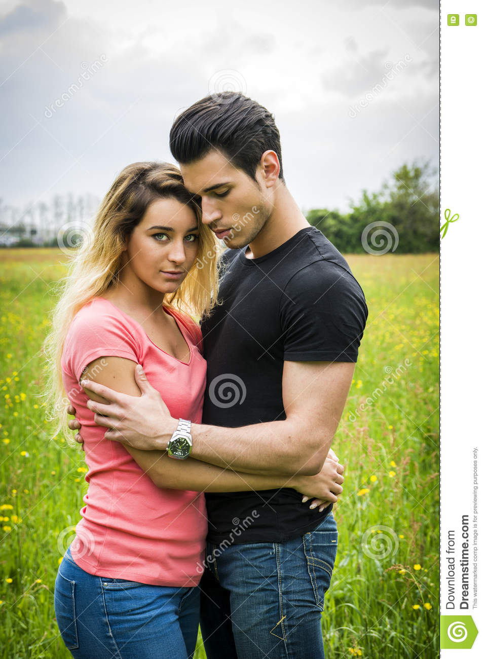 boyfriend-girlfriend-standing-showing-romantic-love-countryside-green-luscious-field-embracing-each-other-cuddling-79667358.jpg