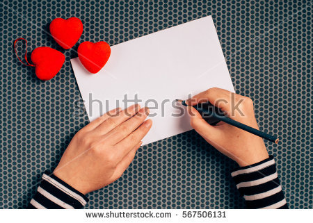 stock-photo-woman-writing-love-letter-or-romantic-poem-for-valentines-day-top-view-of-female-hands-567506131.jpg