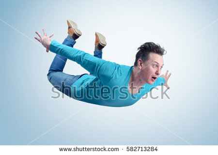 stock-photo-crazy-man-in-shirt-and-jeans-is-flying-in-the-sky-jumper-concept-582713284.jpg