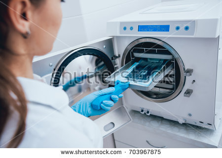stock-photo-sterilizing-medical-instruments-in-autoclave-dental-office-703967875.jpg