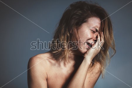 Young woman sad and crying.jpg