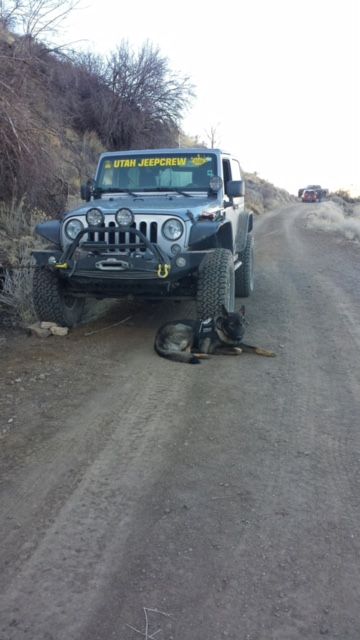 Taking a break. Jeep used to anchor repellers going down a 1000 foot mine shaft in the search..jpeg