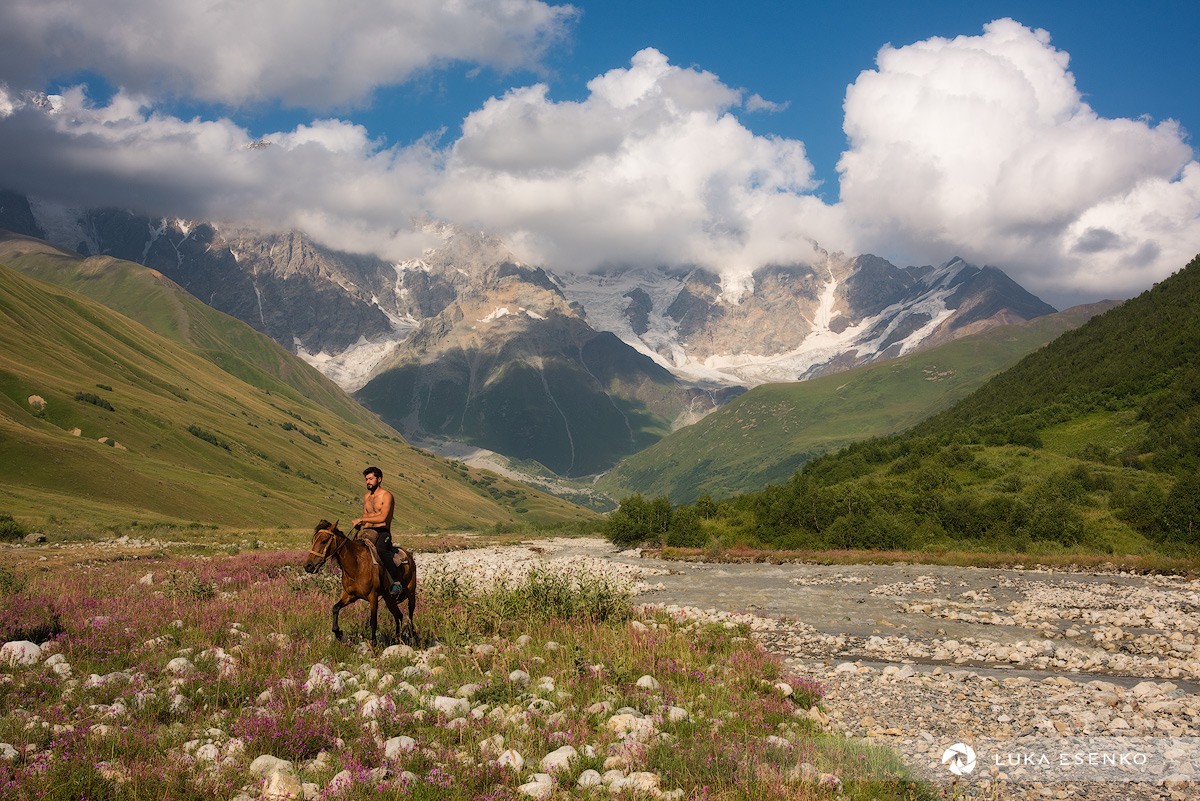 Svaneti horse-back rider and Mount Shkara