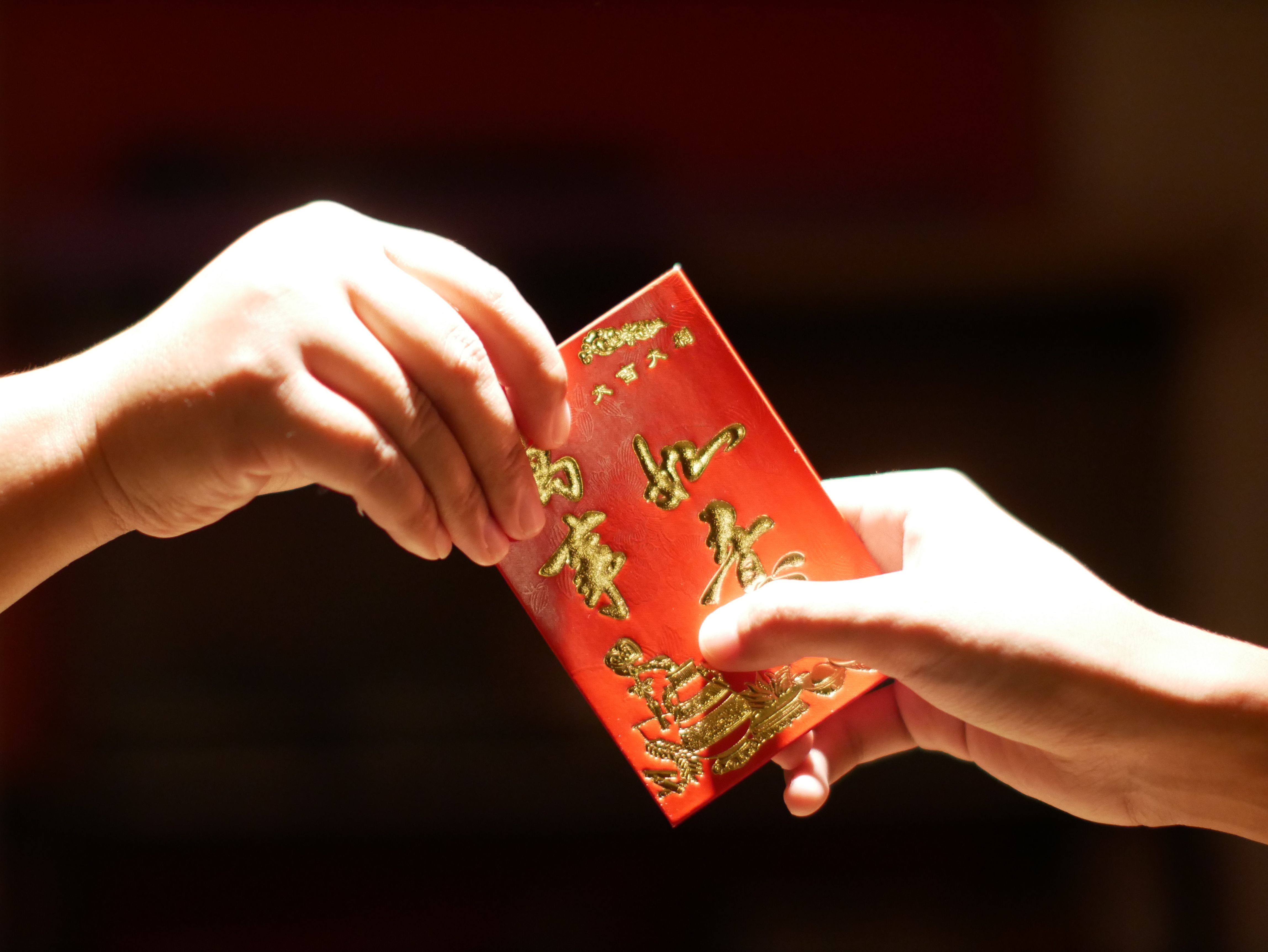 Money In Red Envelope Ang Pao Decorated With Photo Of God Of