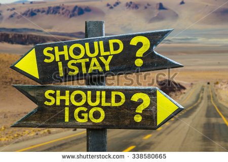 stock-photo-should-i-stay-should-i-go-signpost-in-a-desert-background-338580665.jpg