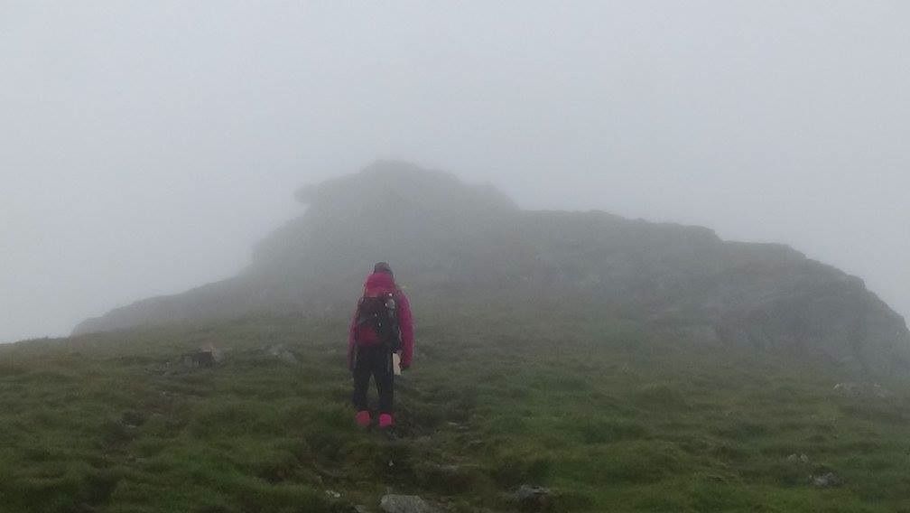 Mandy staring bleakly at the summit of Stob Binnein.jpg