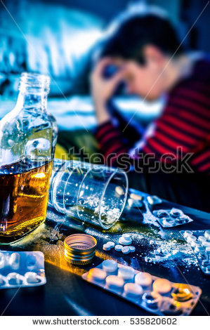 stock-photo-depressed-young-woman-tries-to-commit-suicide-by-medicine-and-alcohol-overdose-535820602.jpg