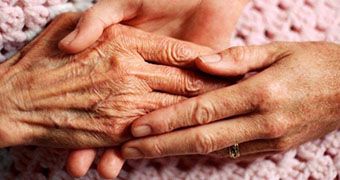 custom-photo-of-elderly-womans-hands-on-pink-crocheted-rug-data.jpg