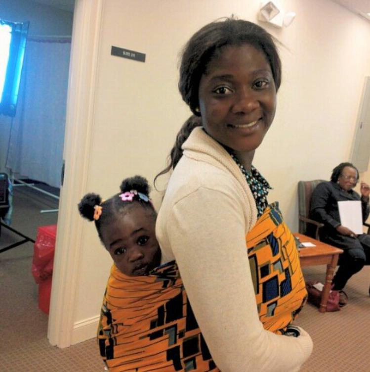 Mercy-Johnson-carrying-Purity-on-her-back.jpg