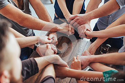 group-diverse-hands-together-joining-concept-teamwork-friendship-85261184.jpg