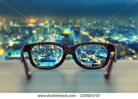 stock-photo-night-cityscape-focused-in-glasses-lenses-225924757.jpg