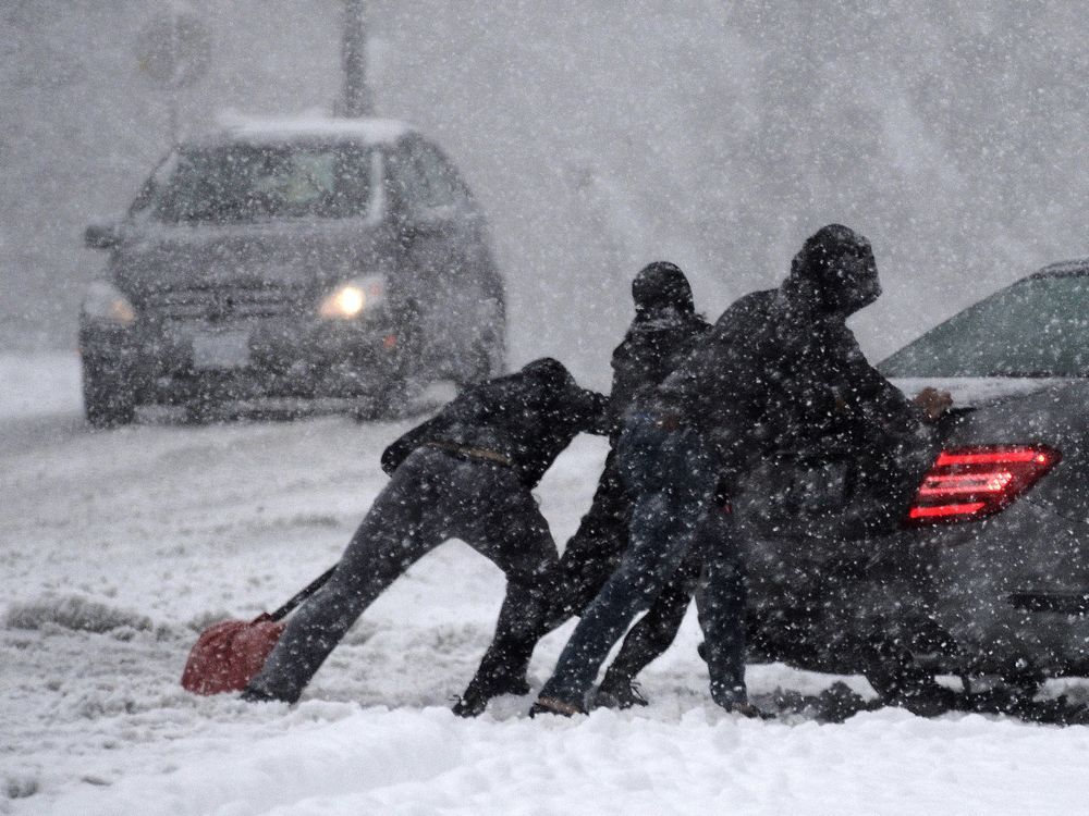 burnaby-bc-december-5-2016-people-push-a-car-during-a.jpg