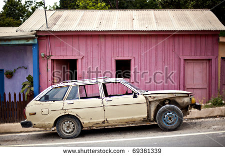stock-photo-old-car-in-front-of-pink-building-69361339.jpg