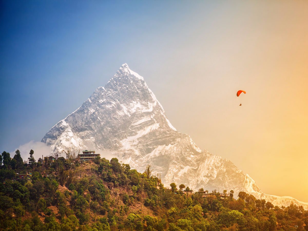 go-paragliding-in-pokhara-where-youll-witness-stunning-views-of-mountains-and-of-the-phewa-lake-below-the-area-also-has-convenient-take-off-and-landing-zones-and-companies-with-trained-staff-members-can-assist-with-the-activity.jpg