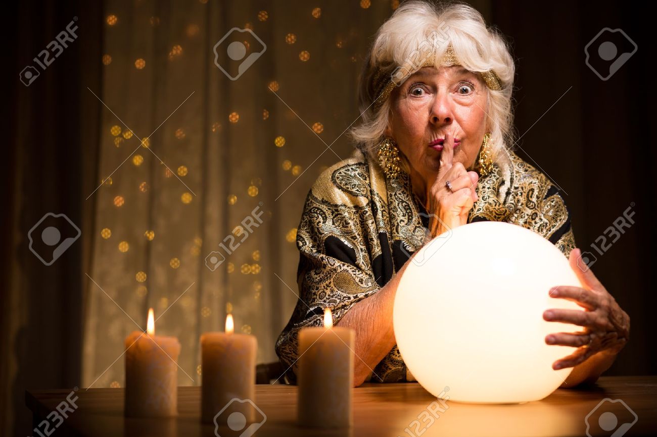 47016487-Female-seer-telling-fortune-from-magic-ball-Stock-Photo-ball.jpg