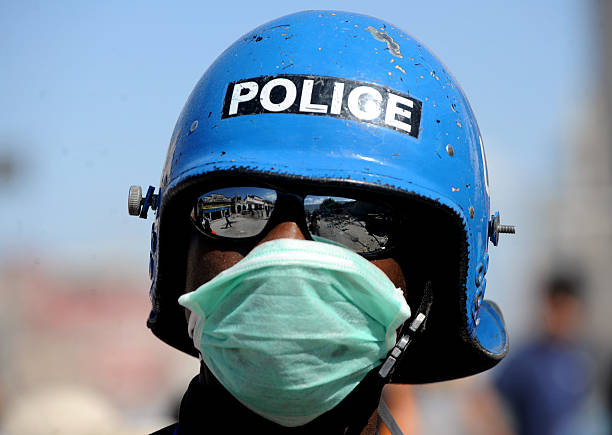 nigerian-policeman-stands-guard-in-a-street-in-portauprince-on-16-picture-id95893564.jpg