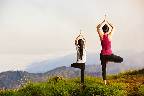 mother and daughter doing yoga.jpg