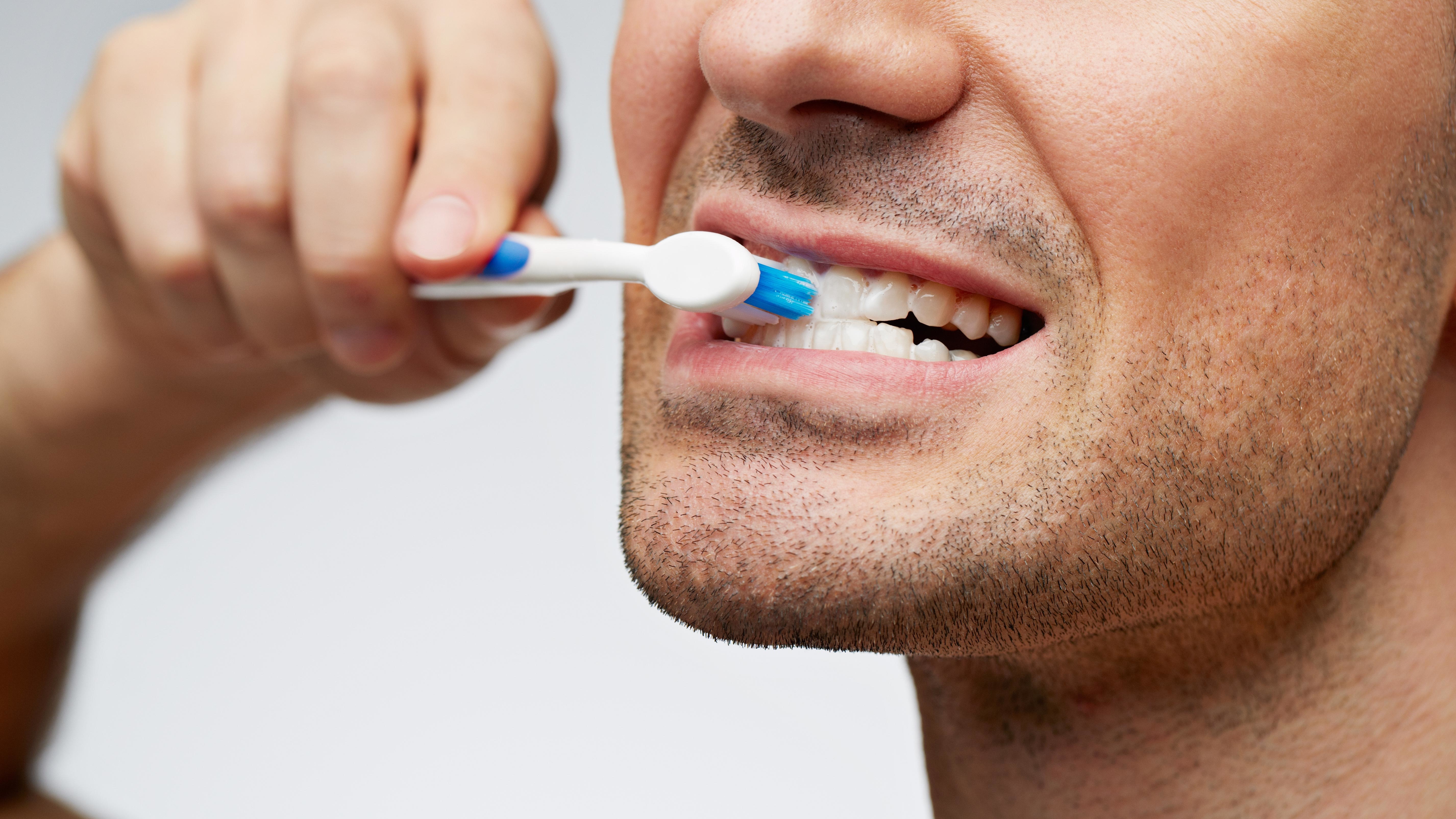 man-brushing-teeth.jpg