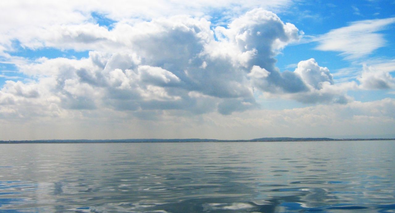 19341004678 - calm waters and epic clouds looking towards the.jpg