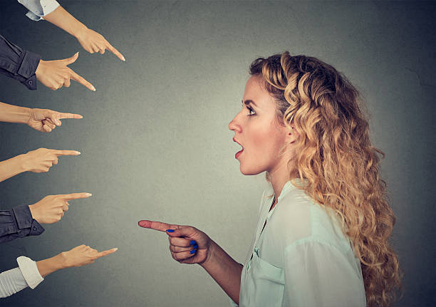 side-profile-shocked-girl-pointing-against-many-fingers-picture-id624683122.jpg