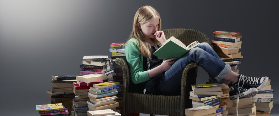 girl reading surrounded by books.jpg