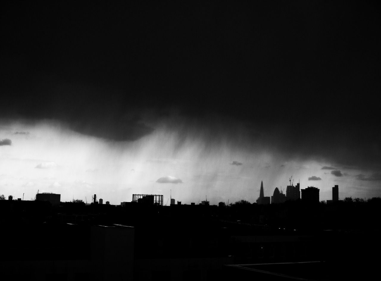 50340539657 - rain sweeps in across the city skyline london_1.jpg