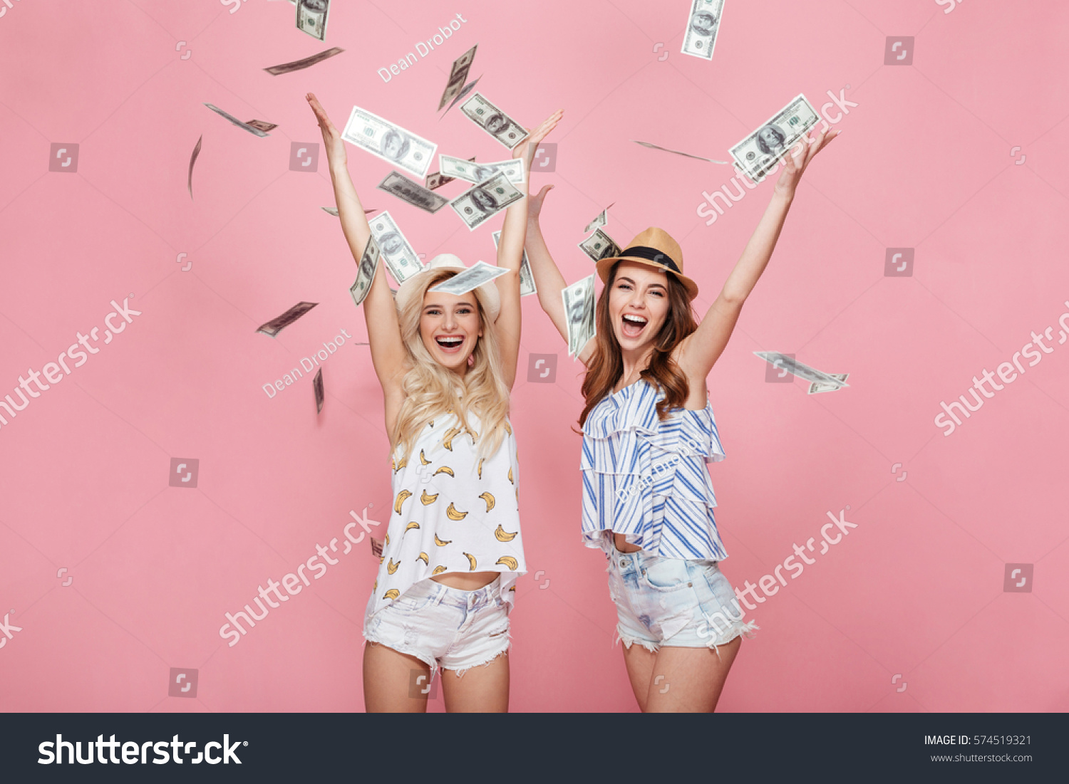 stock-photo-image-of-two-happy-emotional-women-standing-isolated-over-pink-.jpg