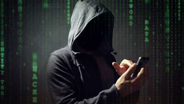 bigstock-computer-hacker-with-mobile-ph-176066794.jpg