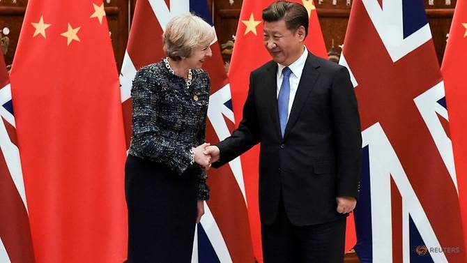 file-photo--chinese-president-xi-jinping-shakes-hand-with-british-prime-minister-theresa-may-before-their-meeting-at-the-west-lake-state-house-on-the-sidelines-of-the-g20-summit--in-hangzhou-1.jpg
