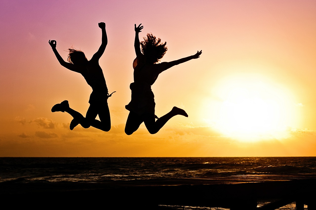 Jump-Sunrise-Two-Happy-Active-Youth-Silhouettes-570881.jpg