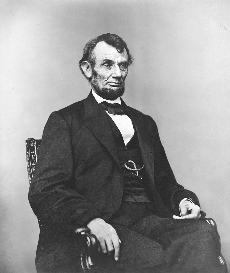 Abraham_Lincoln_seated,_Feb_9,_1864.jpg