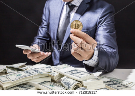 stock-photo-businessman-receive-a-lot-of-money-from-smartphone-businessman-holding-bitcoin-isolated-on-black-712819117.jpg