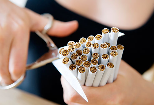 getty_rm_photo_of_woman_cutting_cigarettes_with_scissors.jpg