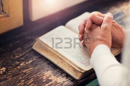 47410099-unrecognizable-woman-holding-a-bible-in-her-hands-and-praying.jpg