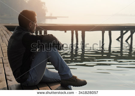 stock-photo-man-sitting-on-old-wooden-dock-and-looking-at-lake-horizon-thinking-contemplation-relaxing-341828057.jpg