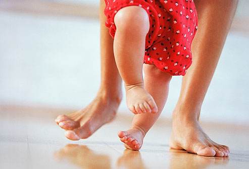 getty_rm_photo_of_mother_teaching_baby_to_walk.jpg