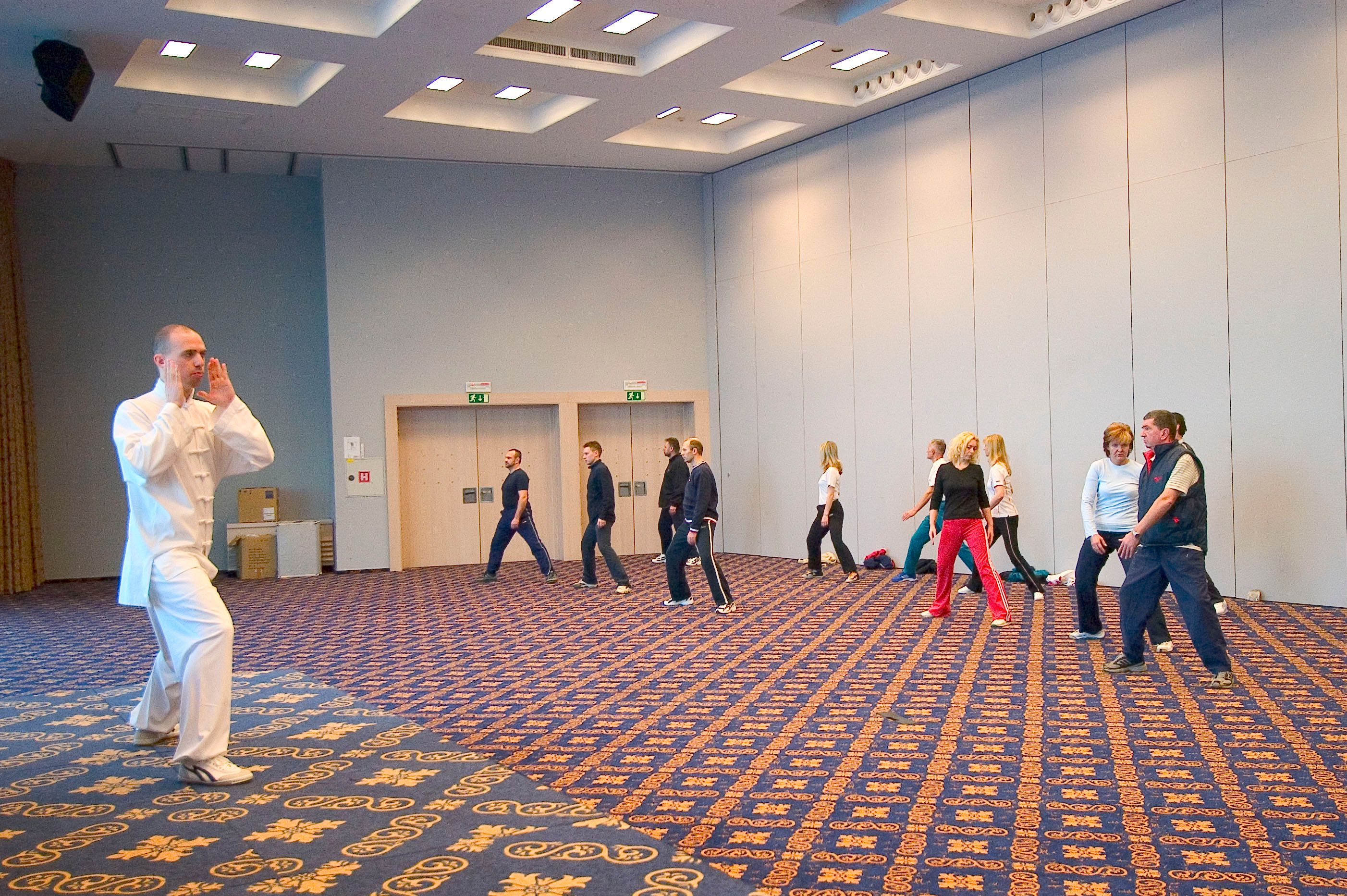 Photo of Valentin Rozman teaching Tai-Chi to employees of Merkur company