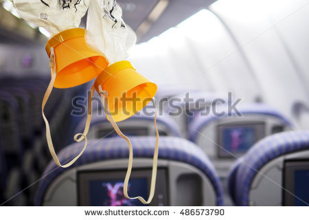 stock-photo-cabin-oxygen-mask-drop-from-the-cabin-ceiling-486573790.jpg