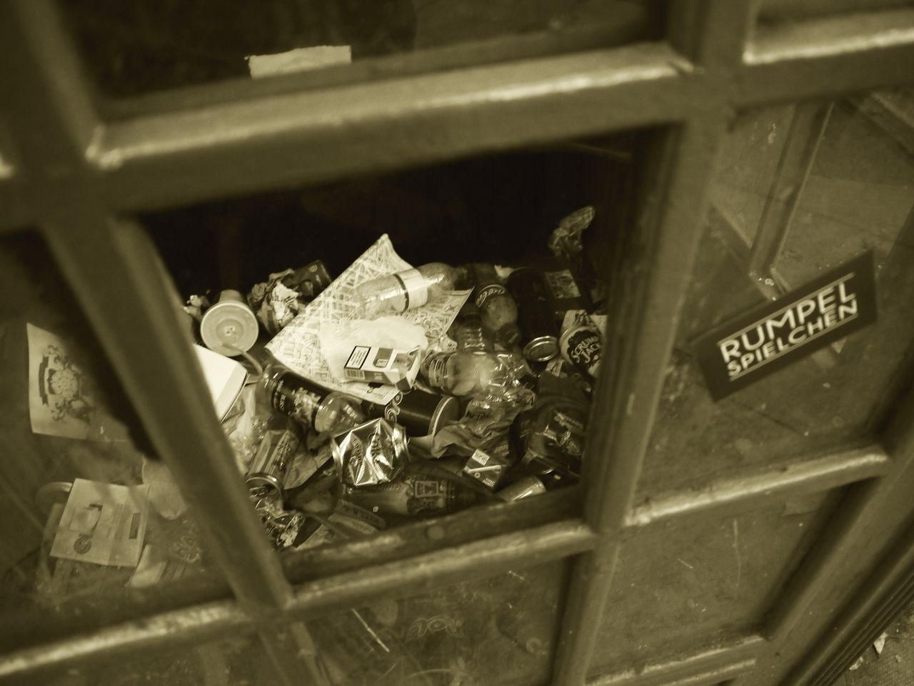 34570327679 - old red telephone box used as a rubbish bin soho.jpg