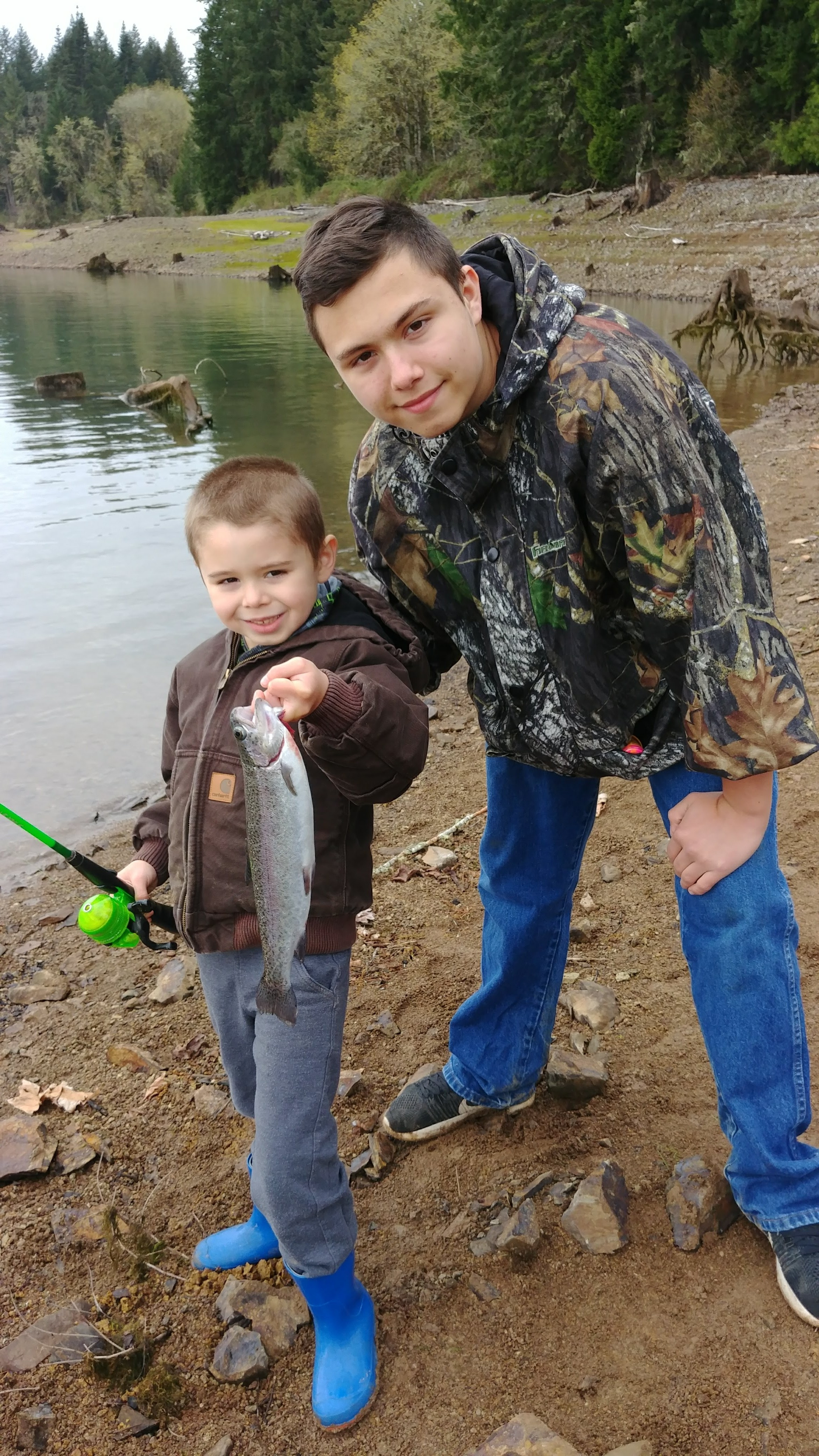 The boys with the biggest catch of the day.png