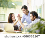 stock-photo-young-asian-business-person-giving-coworker-high-five-in-office-celebrating-achievement-and-success-666362167.jpg