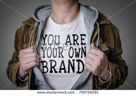 stock-photo-man-showing-you-are-your-own-brand-tittle-on-t-shirt-personal-branding-concept-709729291.jpg