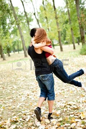 10687000-young-couple-having-fun-in-park.jpg